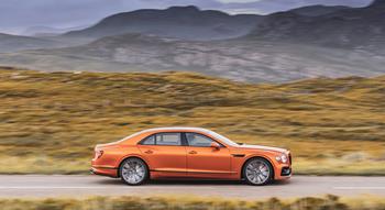 Colour , Orange Image type , Action Angle , Side/Profile Craftsmanship Performance Corporate , Innovation Corporate , Beyond100 Corporate , Company Current Models , New Flying Spur , Flying Spur Speed 
