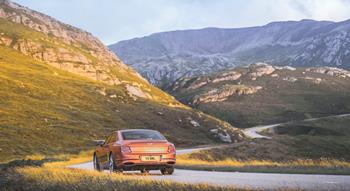 Colour , Orange Image type , Action Angle , Rear Craftsmanship Performance Corporate , Innovation Corporate , Beyond100 Corporate , Company Current Models , New Flying Spur , Flying Spur Speed 